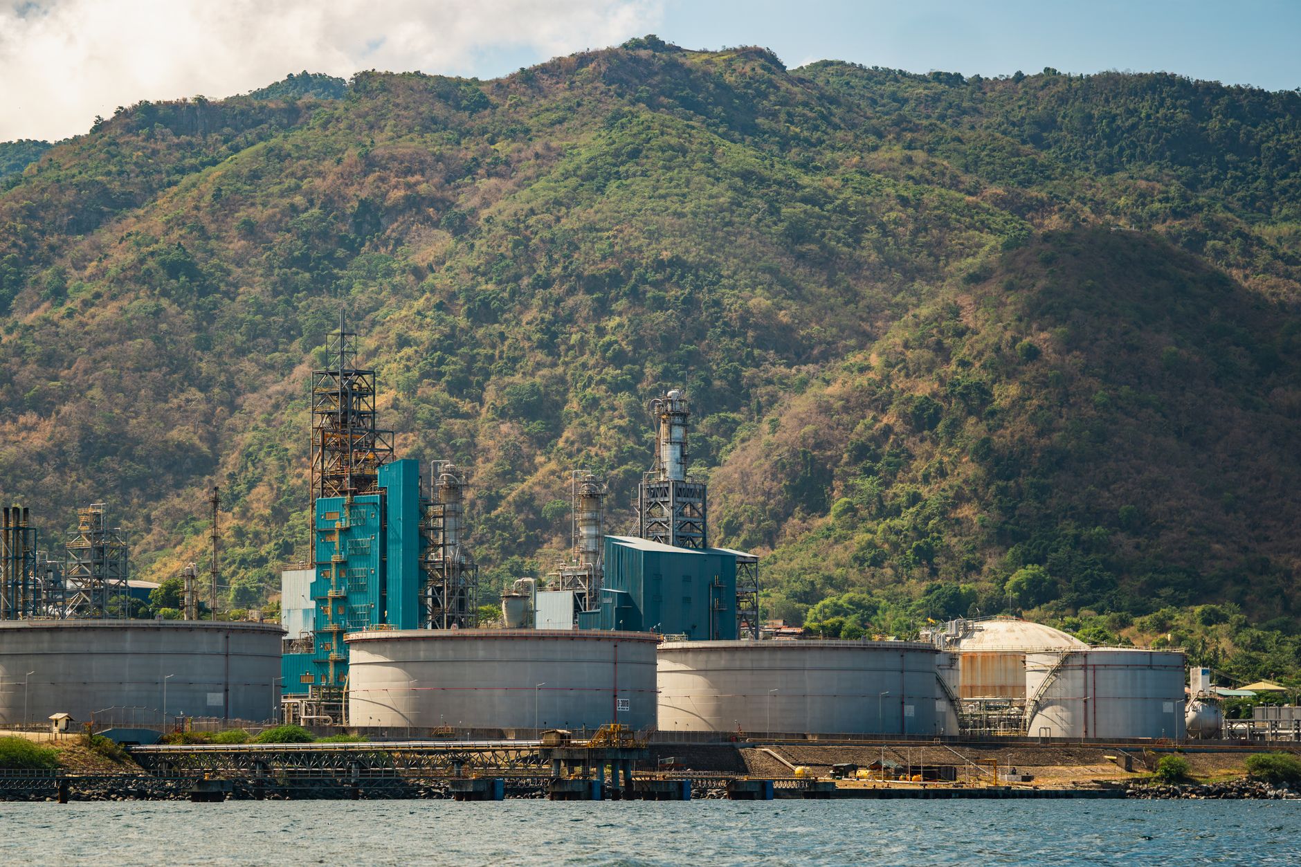 Industrial energy storage facility with turbines and compressed air infrastructure