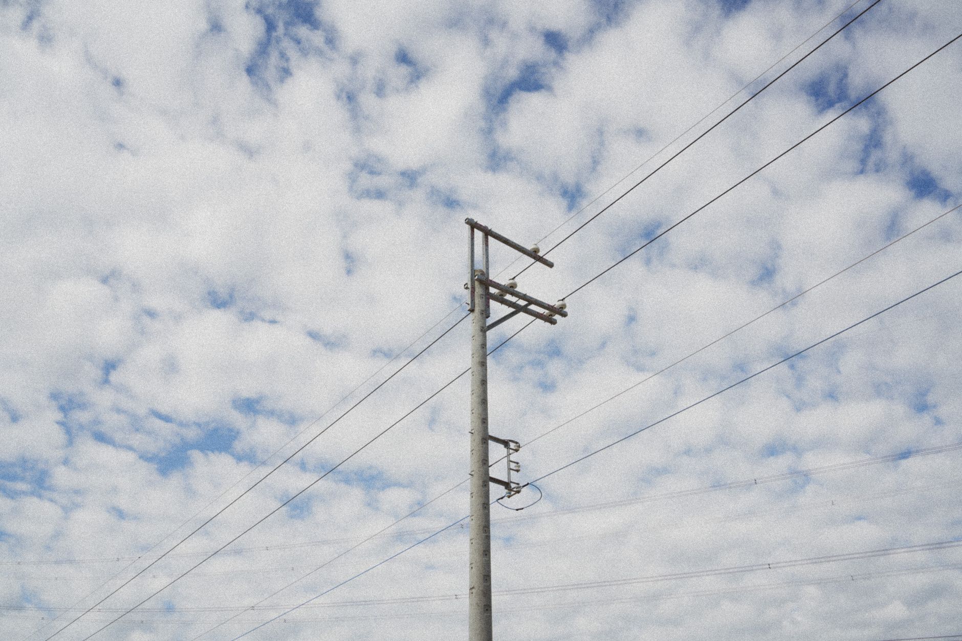 Electricity transmission lines and grid infrastructure in open landscape