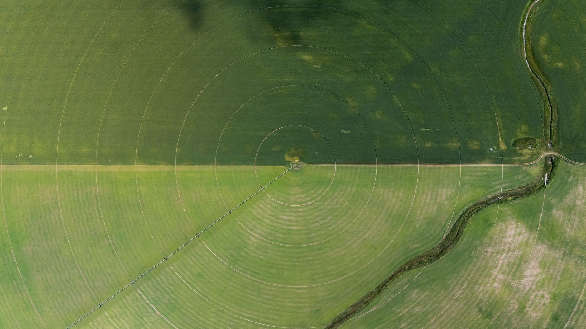 Aerial view of irrigated agricultural land in a dry Western landscape