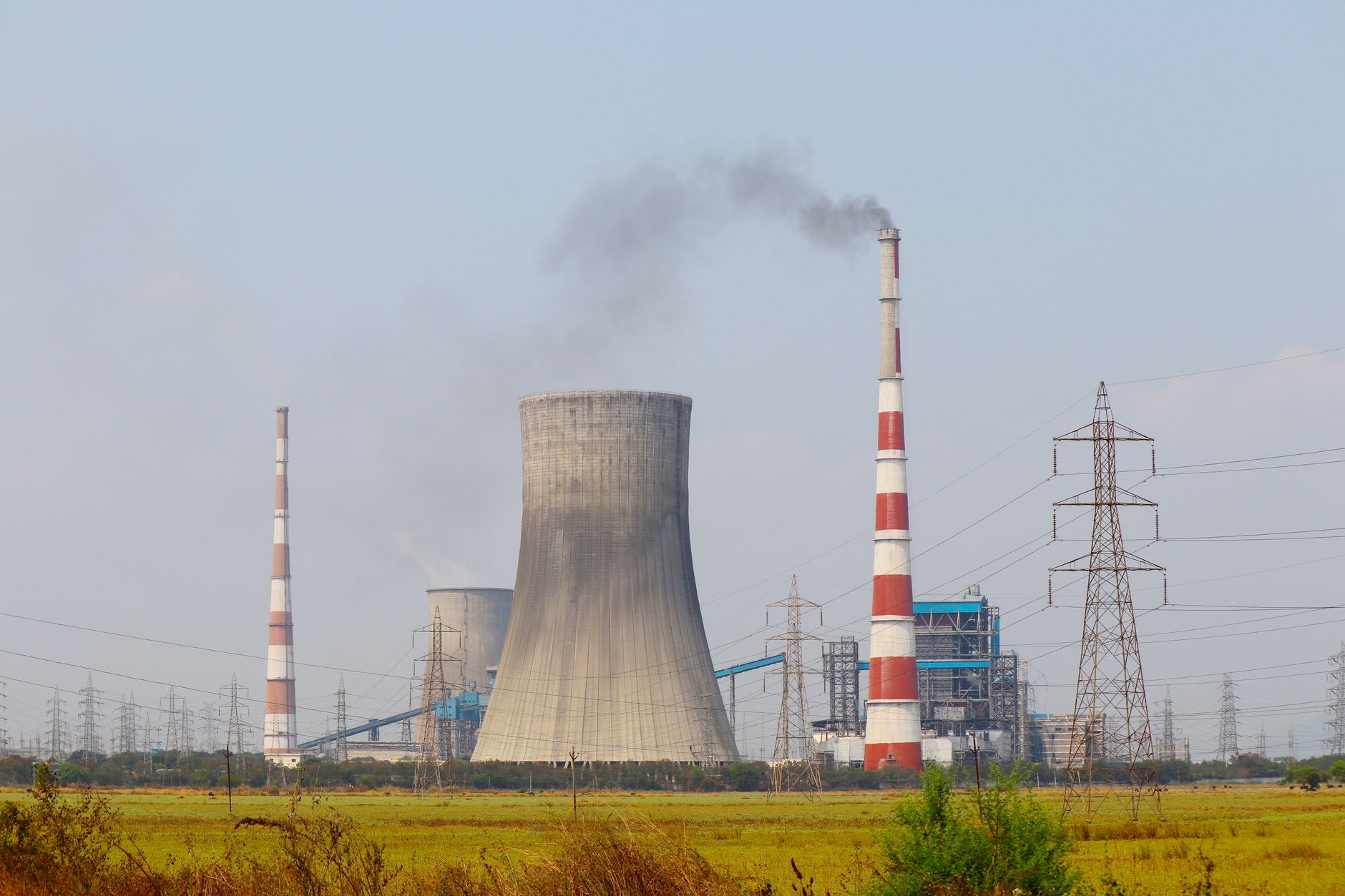 Heavy industrial facility with emissions infrastructure representing carbon capture operations