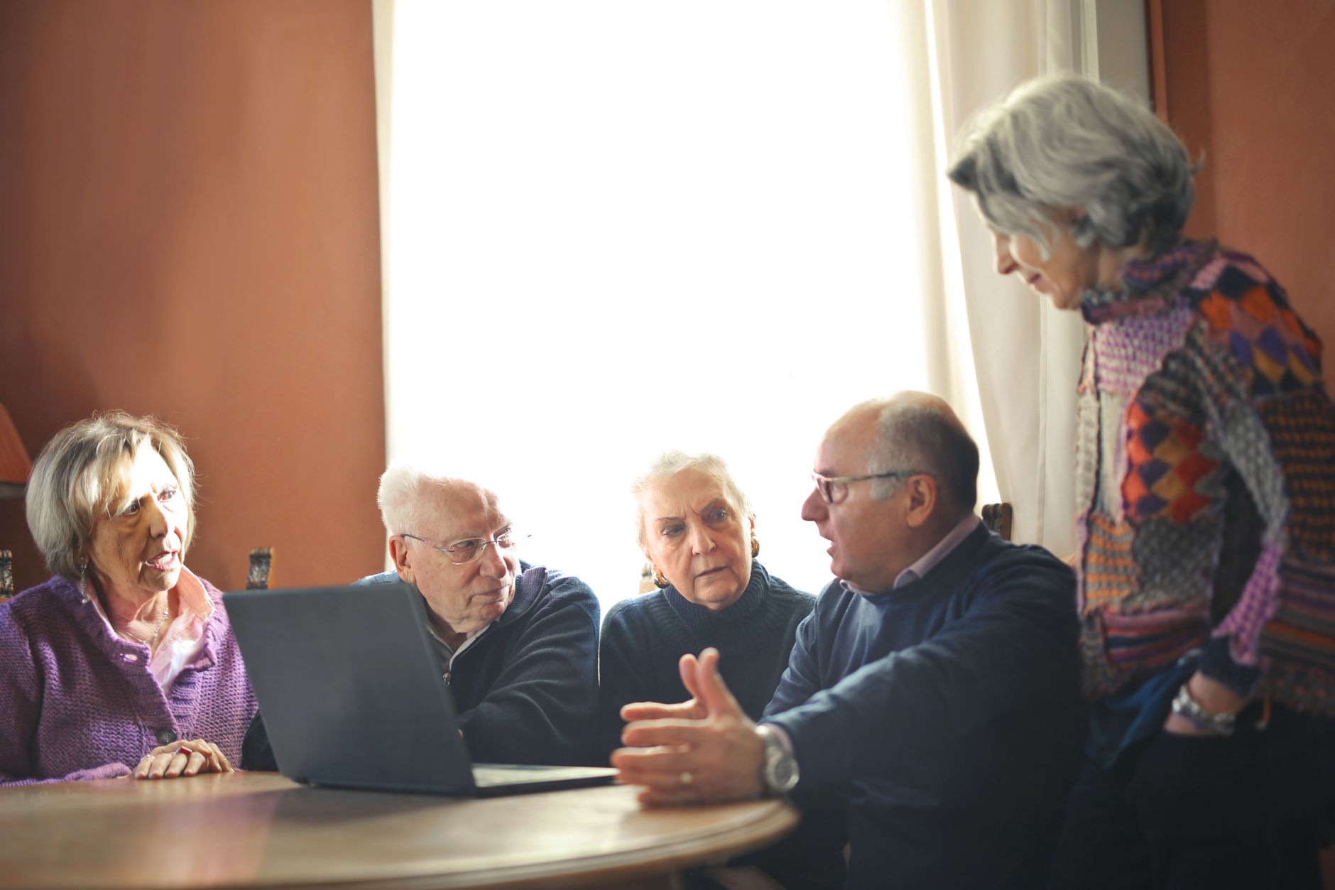 Institutional investors reviewing fixed-income portfolio documents at a conference table