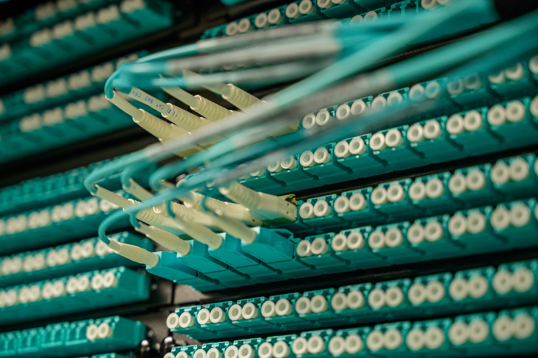 Fiber optic cables running through an industrial conduit representing broadband infrastructure along rail easements