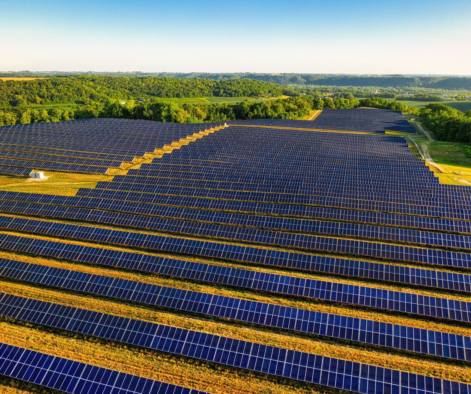 Aerial view of industrial energy infrastructure corridor across open landscape