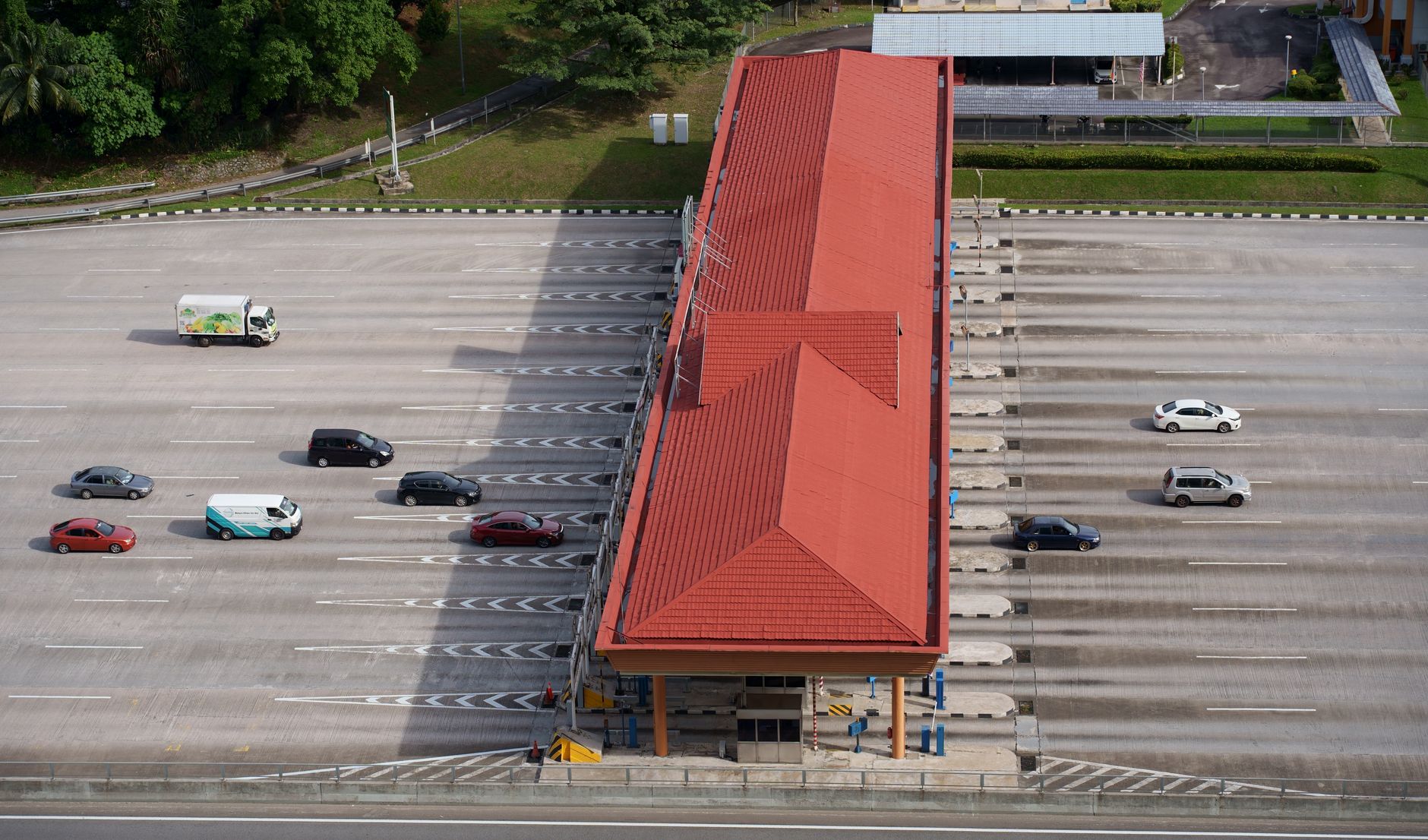 Aerial view of a toll booth and highway infrastructure