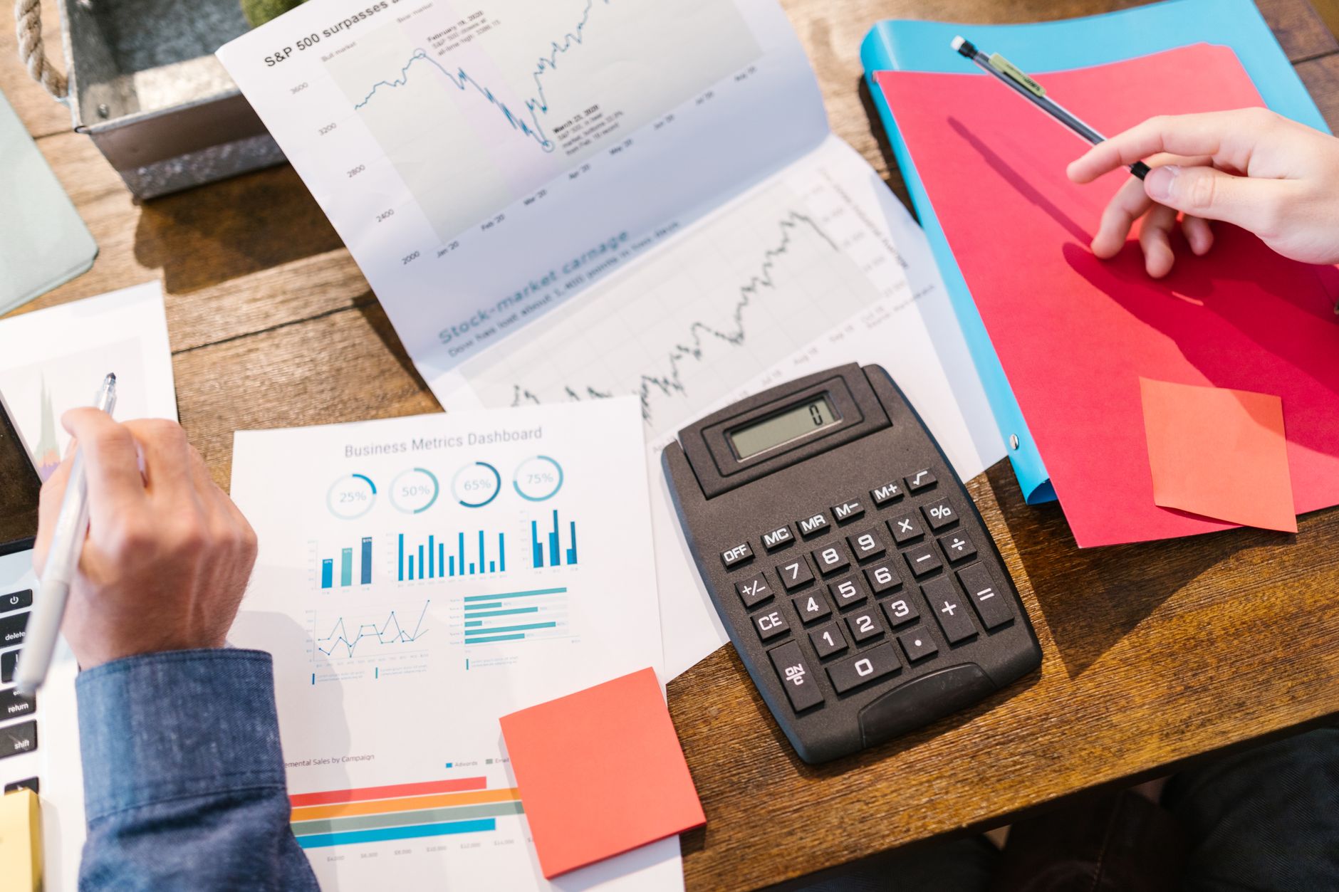Hedge fund office with financial analysts reviewing investment positions