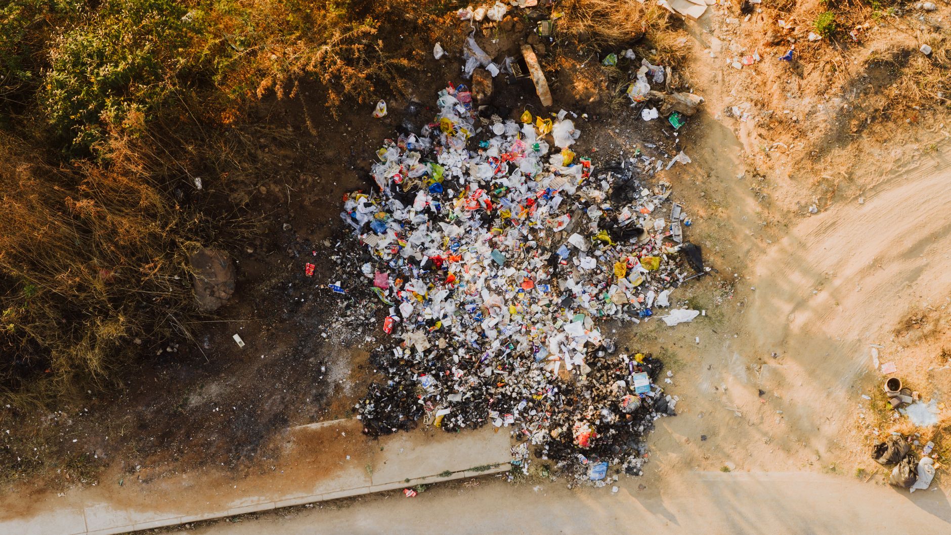 Aerial view of a large municipal landfill site where methane gas capture systems are commonly installed