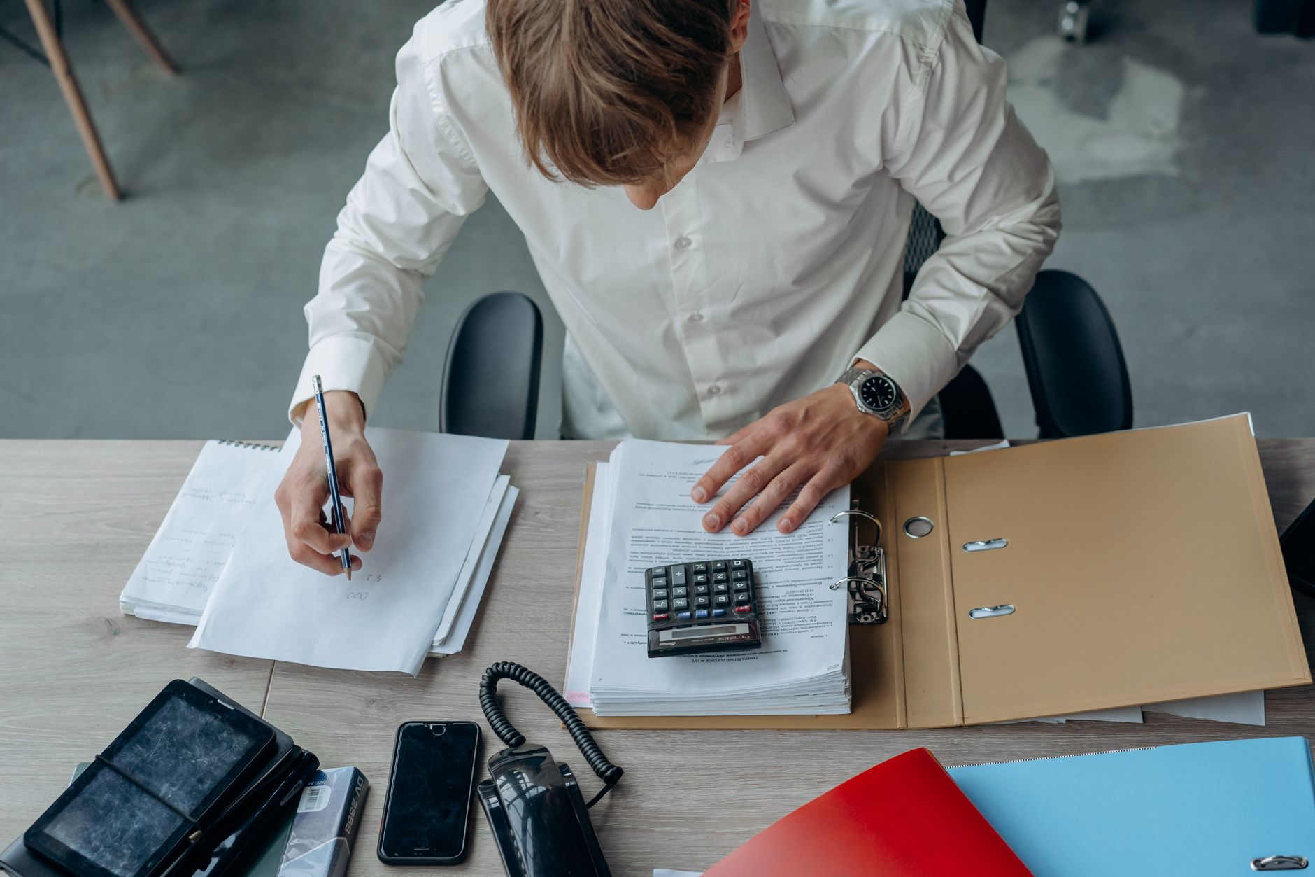 Financial documents on a desk representing royalty investment due diligence and portfolio allocation