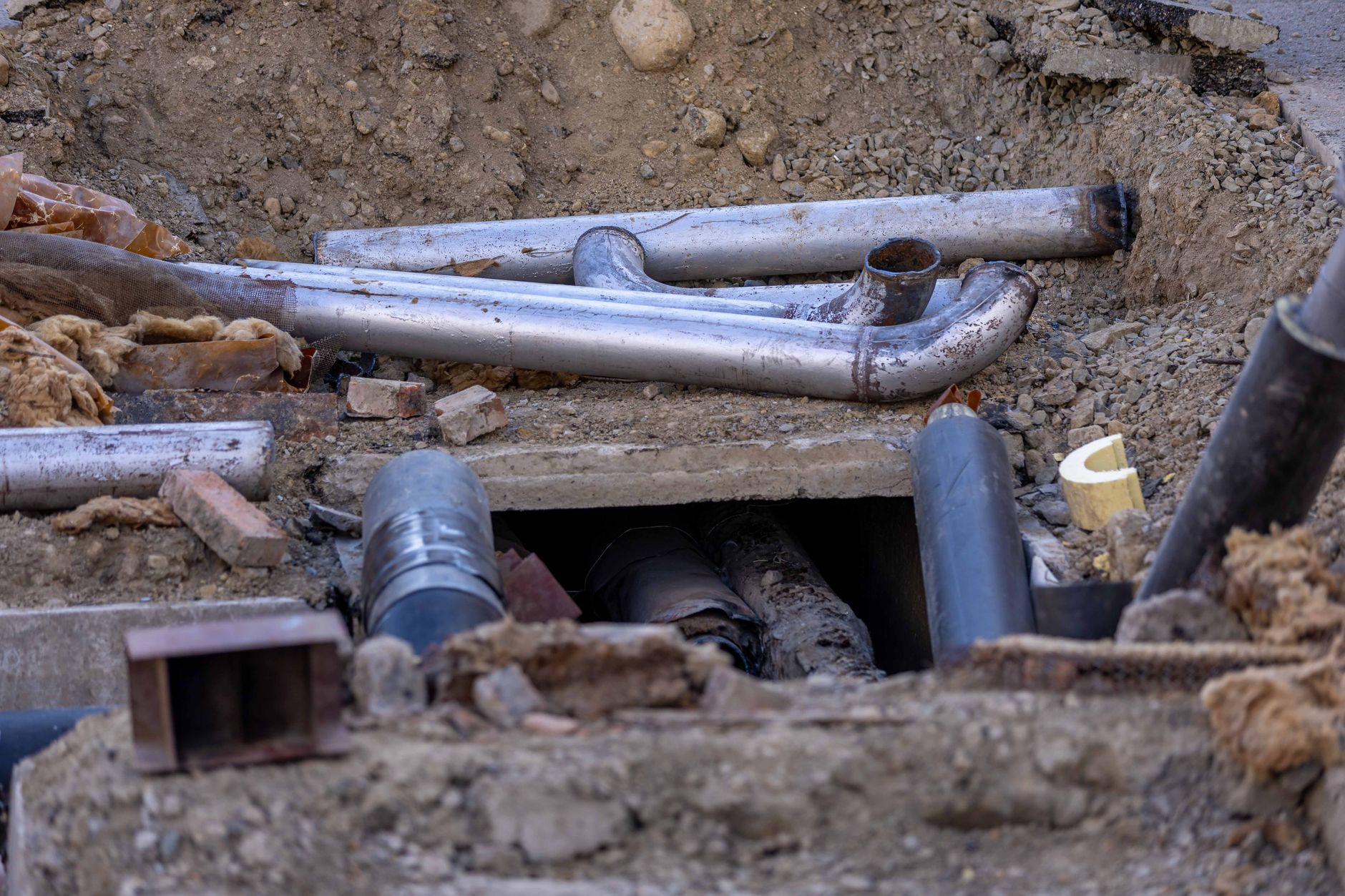 Large underground municipal water and sewage pipes during infrastructure construction