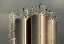 Large industrial liquid storage tanks at a distribution terminal facility