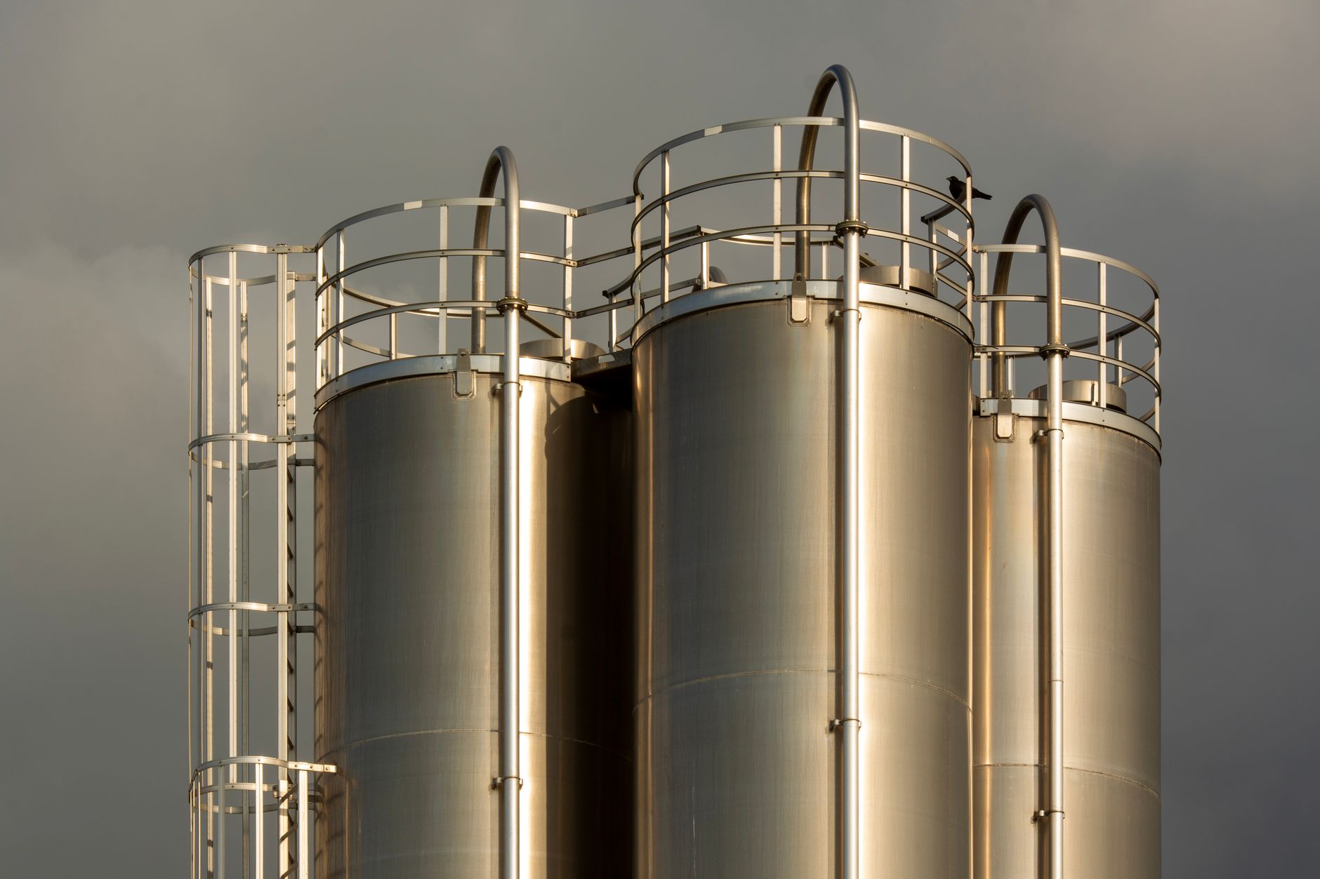 Large industrial liquid storage tanks at a distribution terminal facility