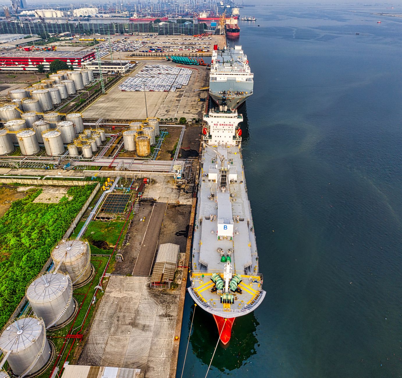 Large crude oil storage tanks at a coastal marine terminal facility
