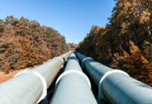 Aerial view of a freight pipeline corridor running across open land