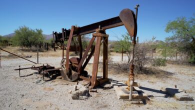 Oil well equipment in an open field representing oilfield infrastructure investment