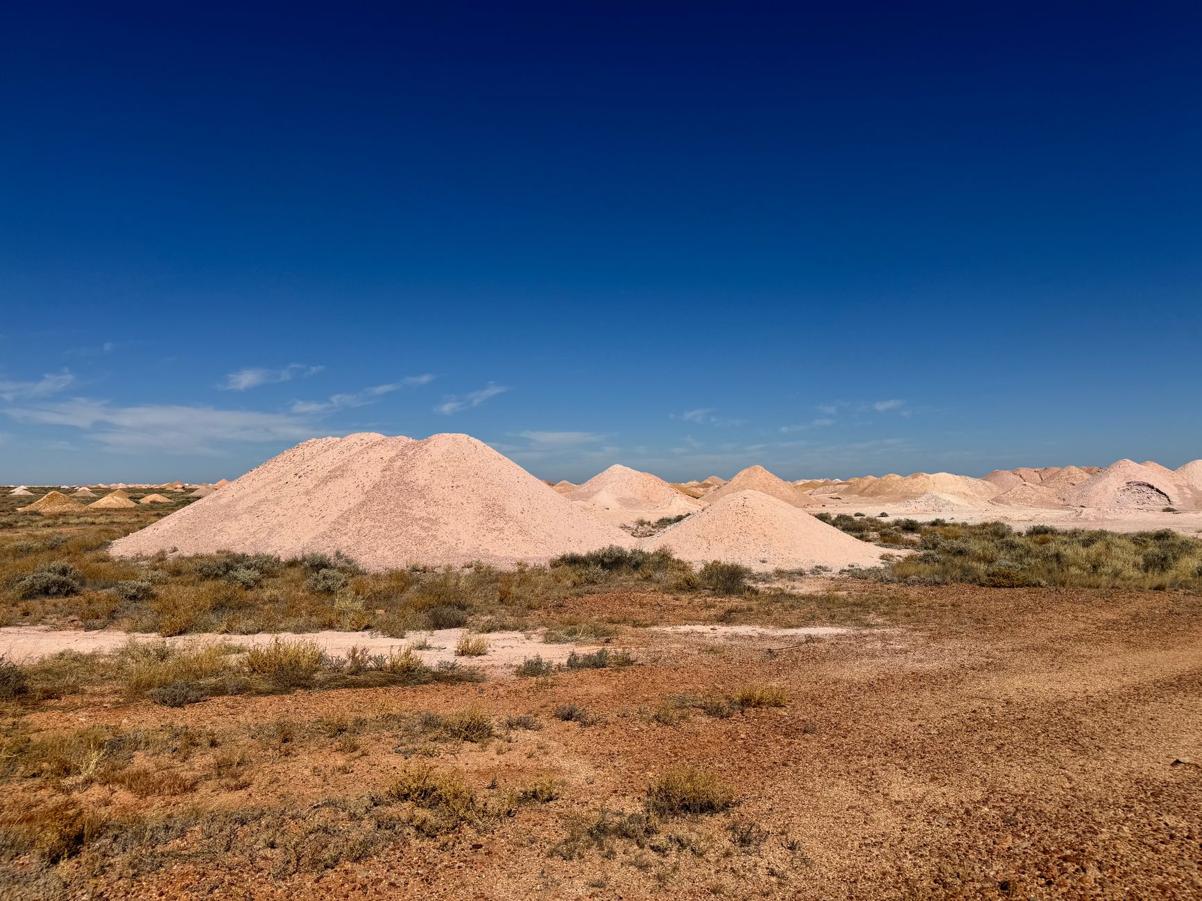 Aerial view of a large open-pit potash mining operation with extraction equipment