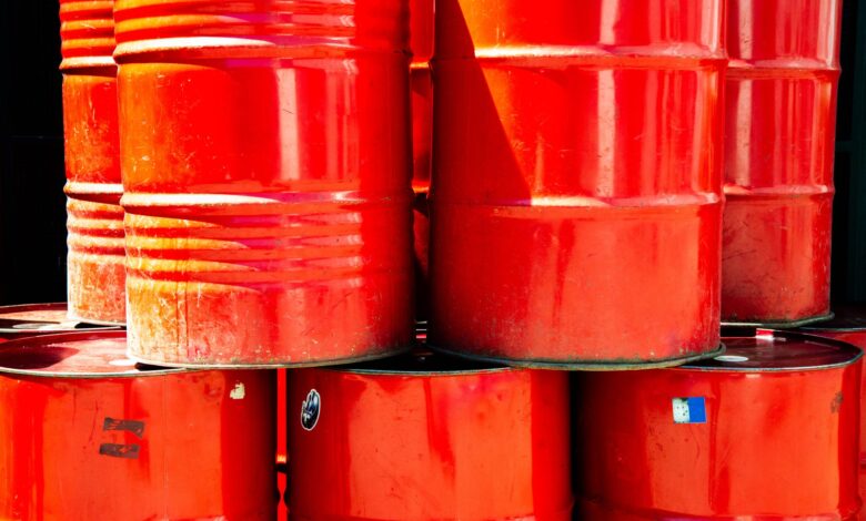 Large industrial chemical storage tanks at a port terminal facility
