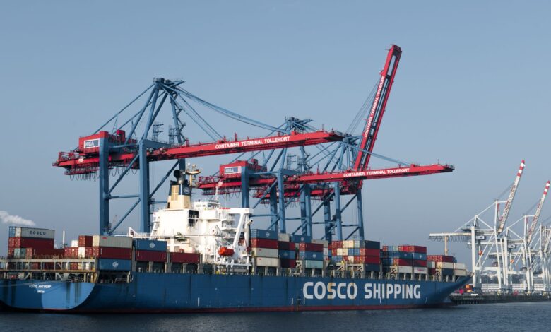 Large industrial port terminal with storage tanks and shipping infrastructure