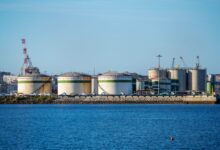 Large industrial storage terminal with tanks and pipelines for bulk liquid commodities
