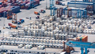 Aerial view of a deepwater container port with large cargo vessels docked at terminal berths