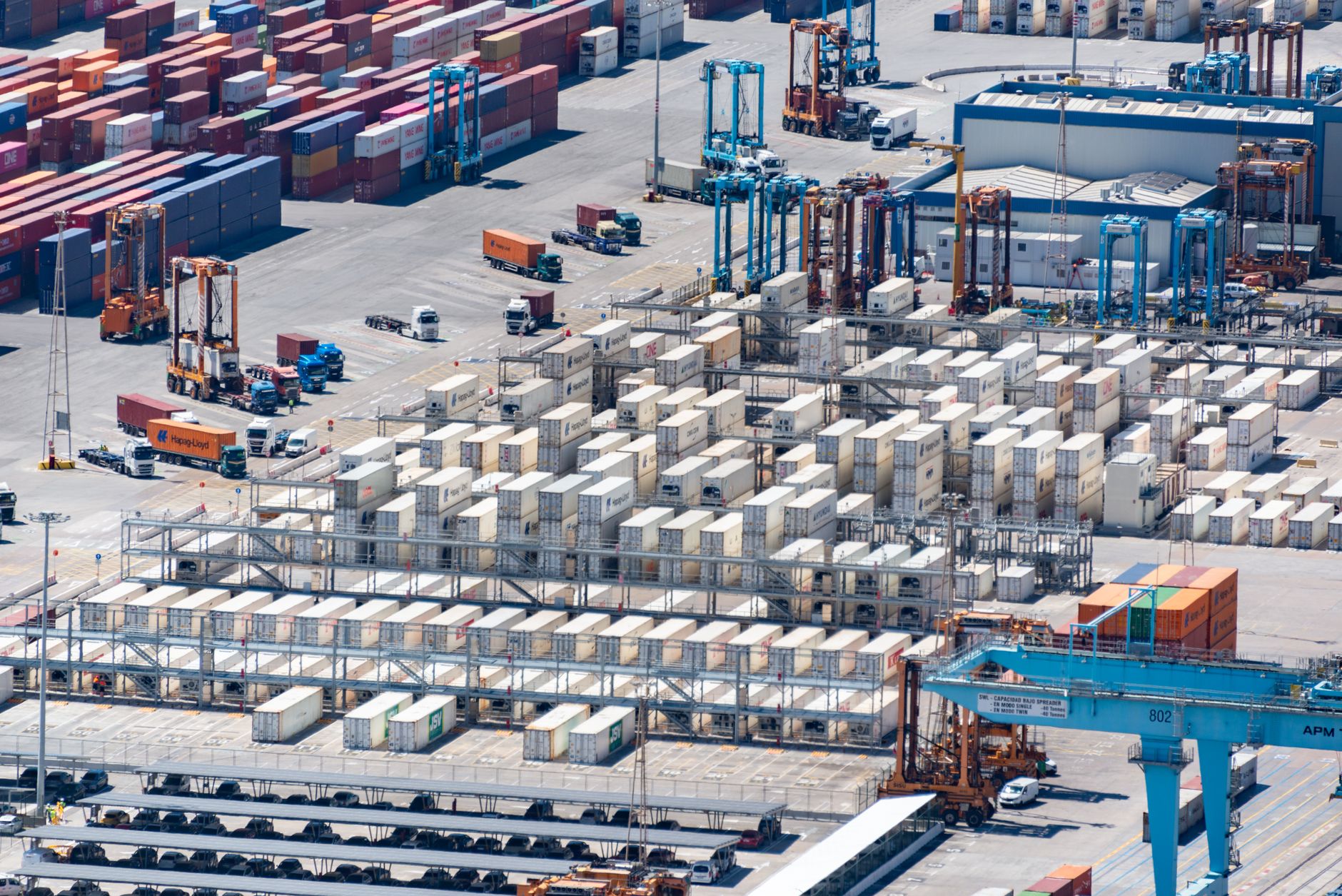 Aerial view of a deepwater container port with large cargo vessels docked at terminal berths