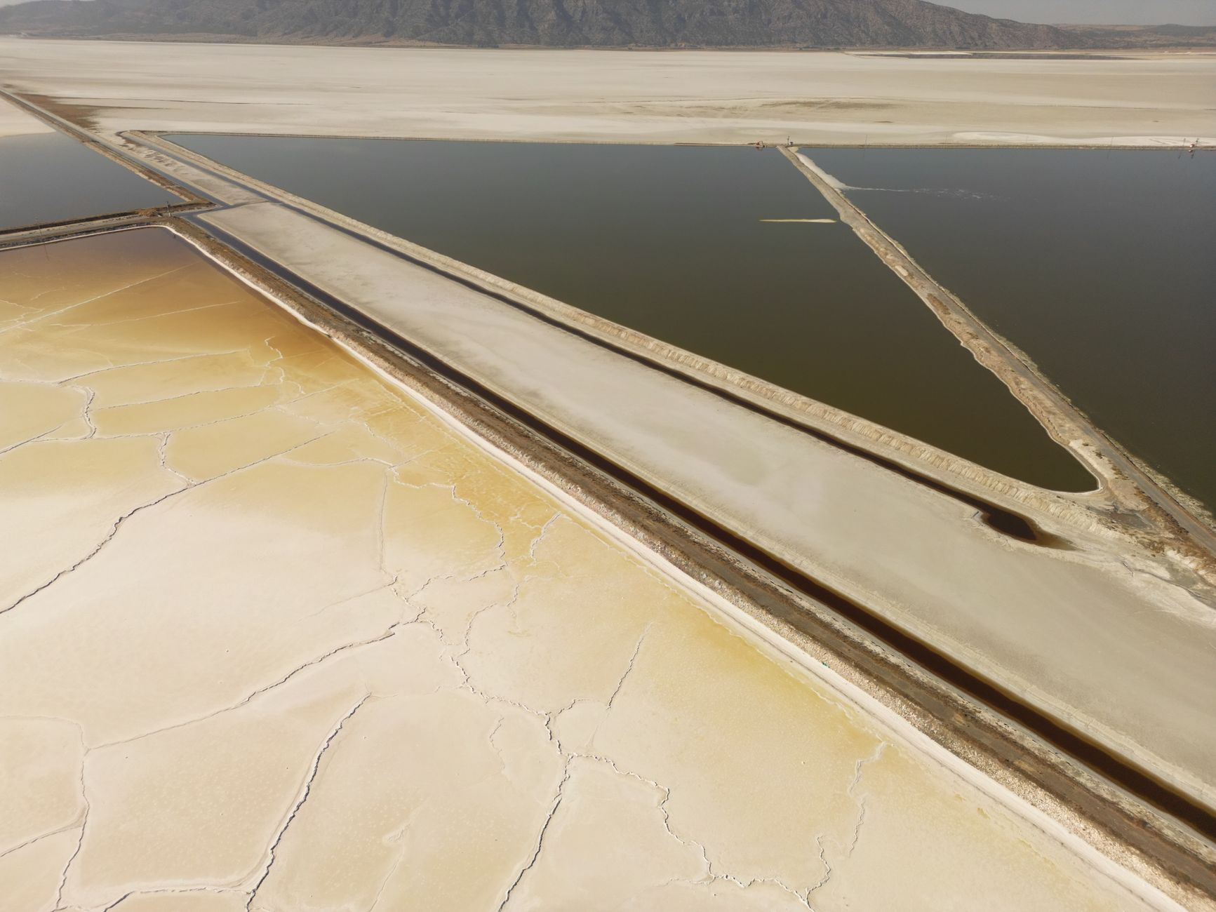 Aerial view of a vast salt flat landscape where lithium brine deposits are found