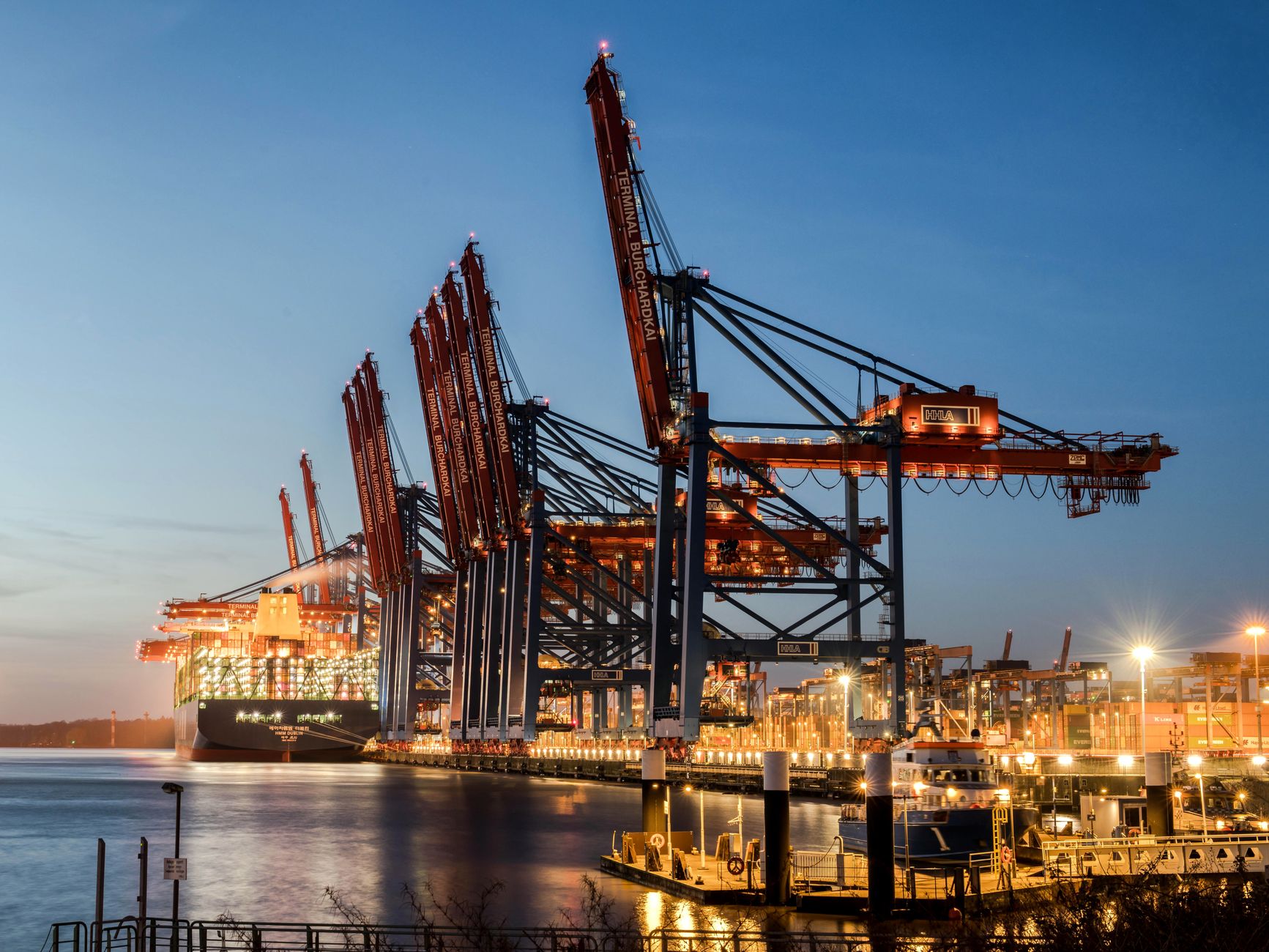 Aerial view of a major industrial port with energy storage and logistics infrastructure