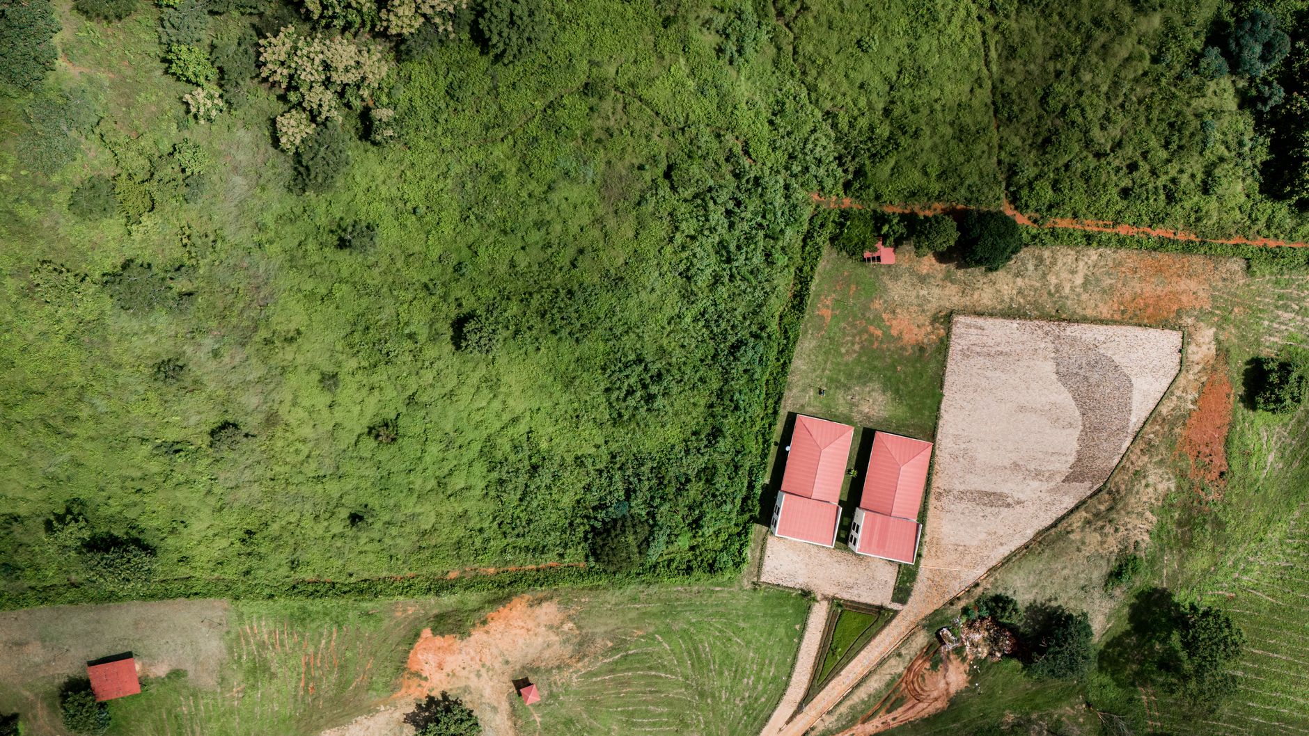 Surveyors working in an open field measuring land for infrastructure development