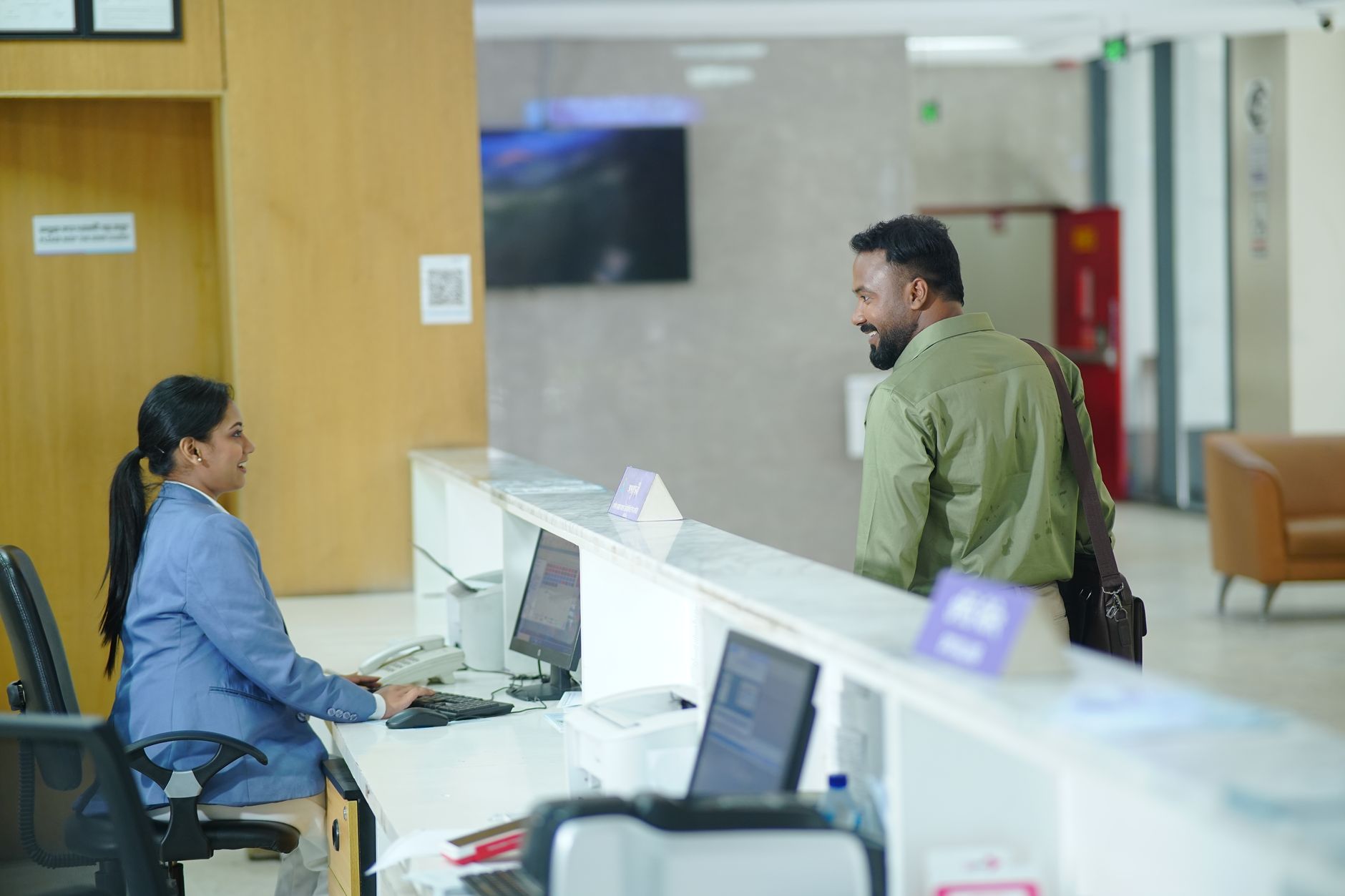 Financial professionals reviewing investment documents in an institutional office setting