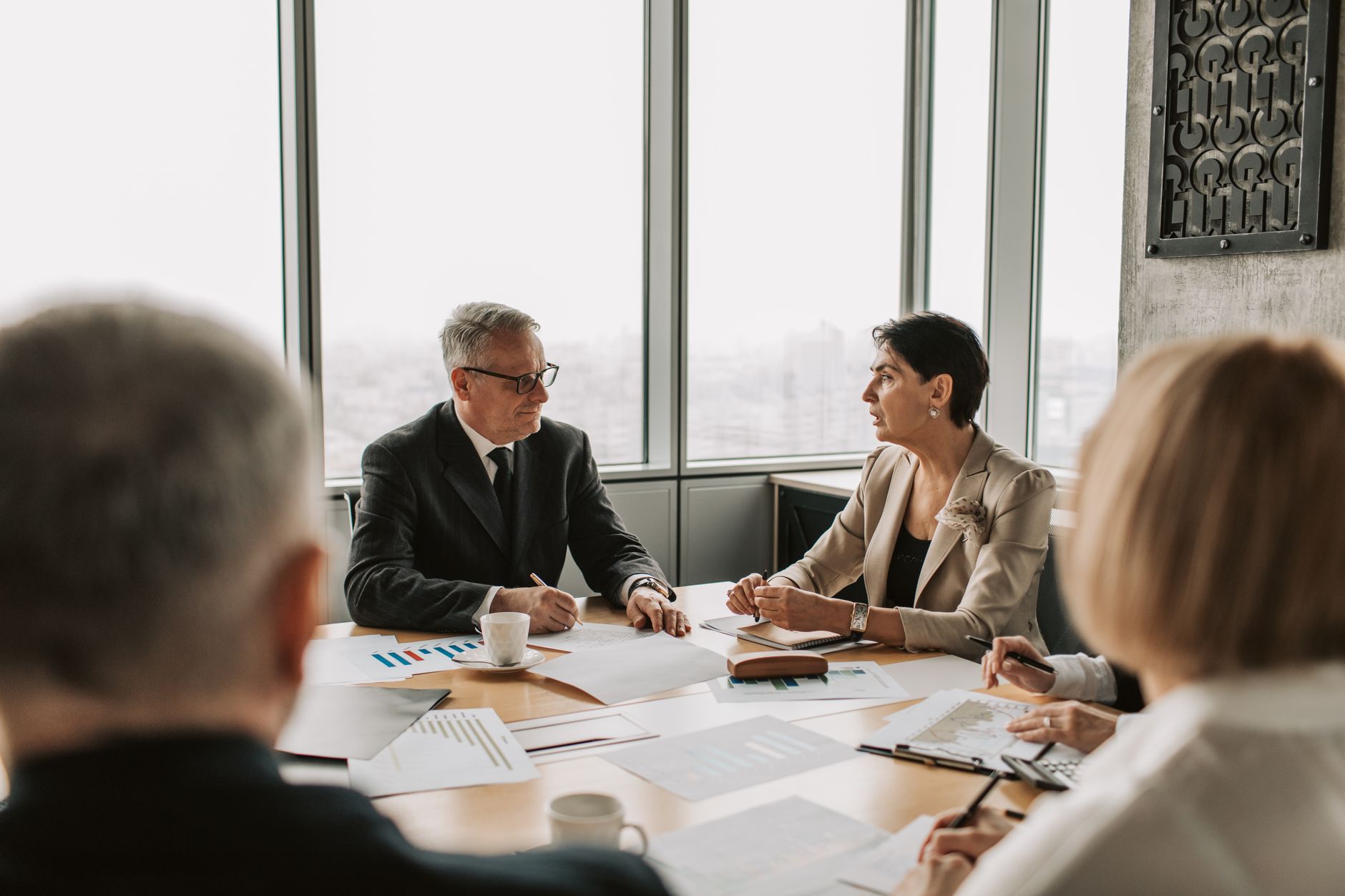 Business professionals in a boardroom discussing sovereign investment strategy