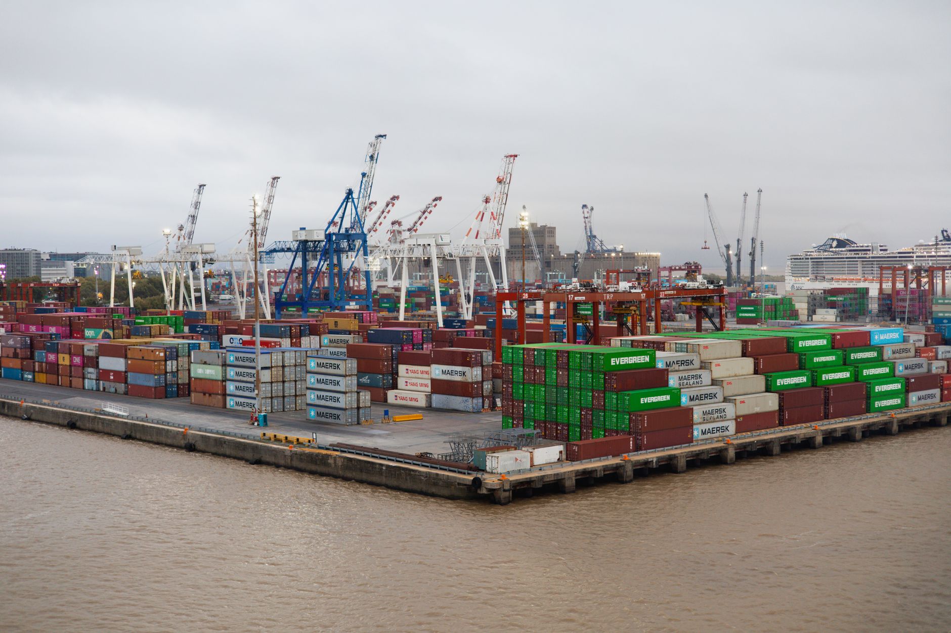Commercial cargo ship docked at a chemical handling port facility