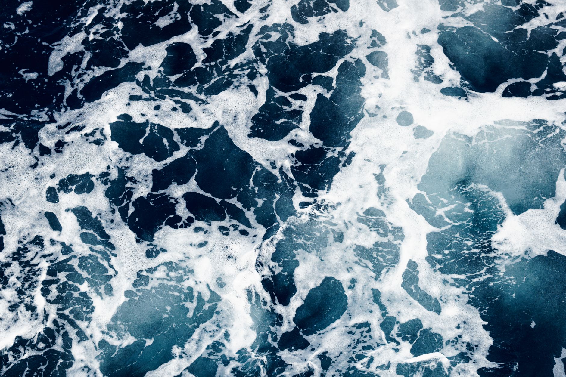 Aerial view of ocean waters representing subsea infrastructure corridors and seabed governance