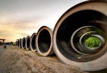 Industrial pipeline under construction across open land