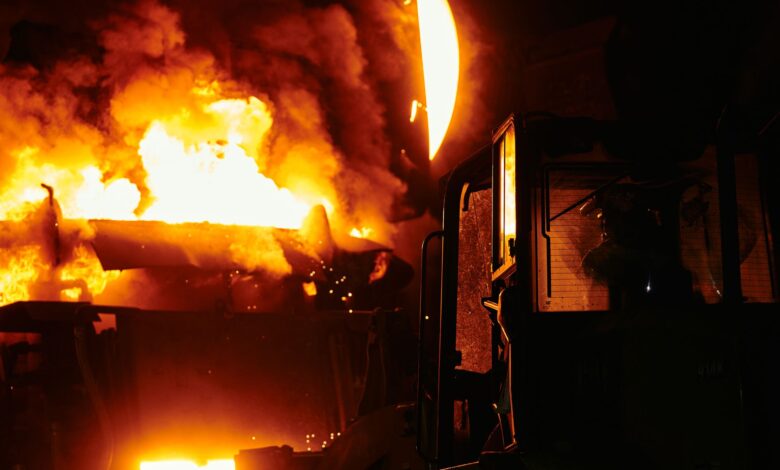 Interior of an industrial zinc smelting facility with molten metal processing equipment
