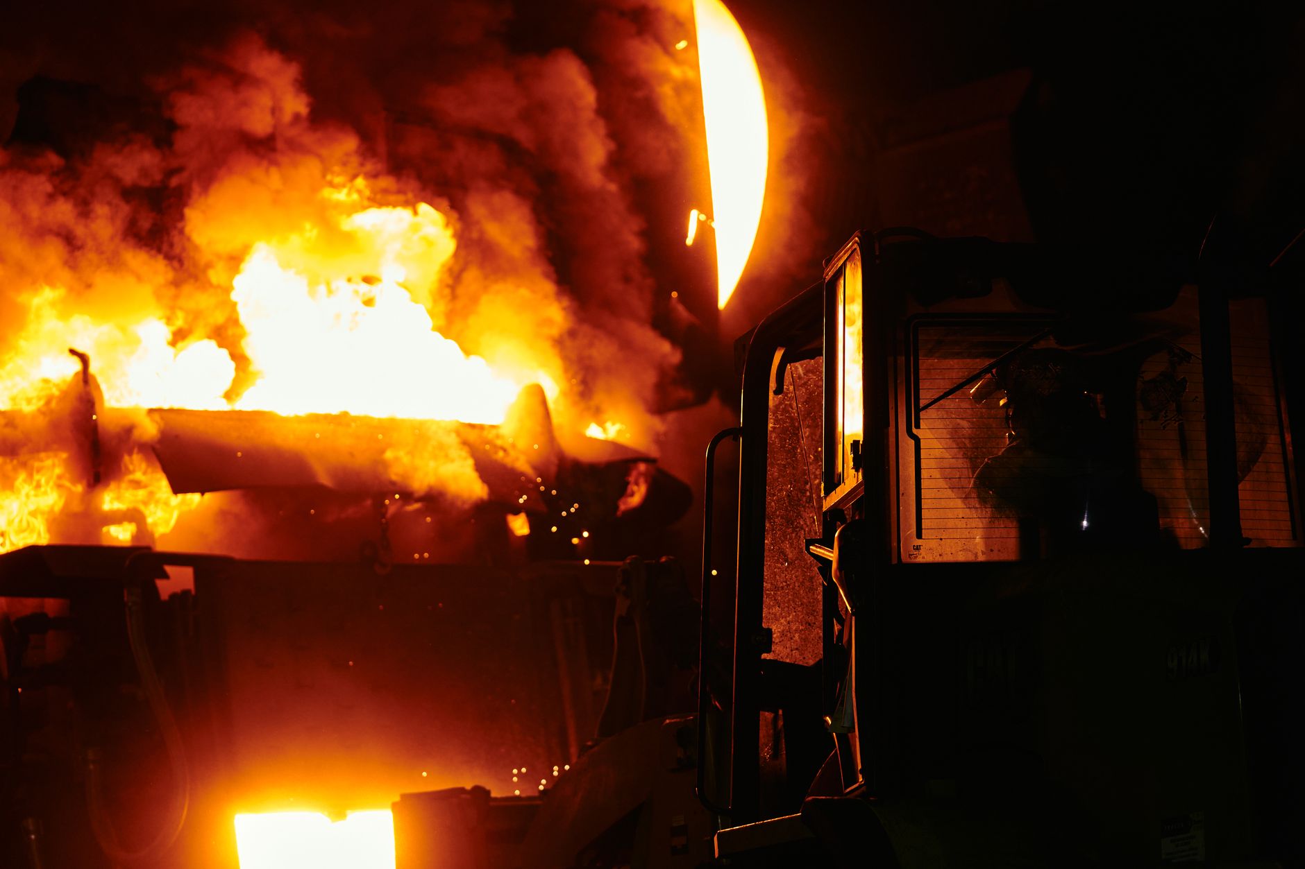 Interior of an industrial zinc smelting facility with molten metal processing equipment