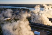 Aerial view of a bulk commodity coal terminal with loading berths along a port waterway