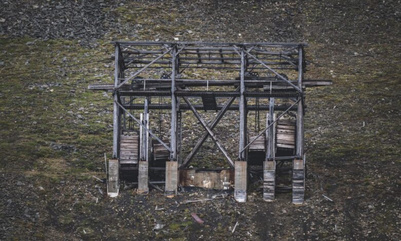 Aerial view of an open-pit graphite mining operation showing excavation layers
