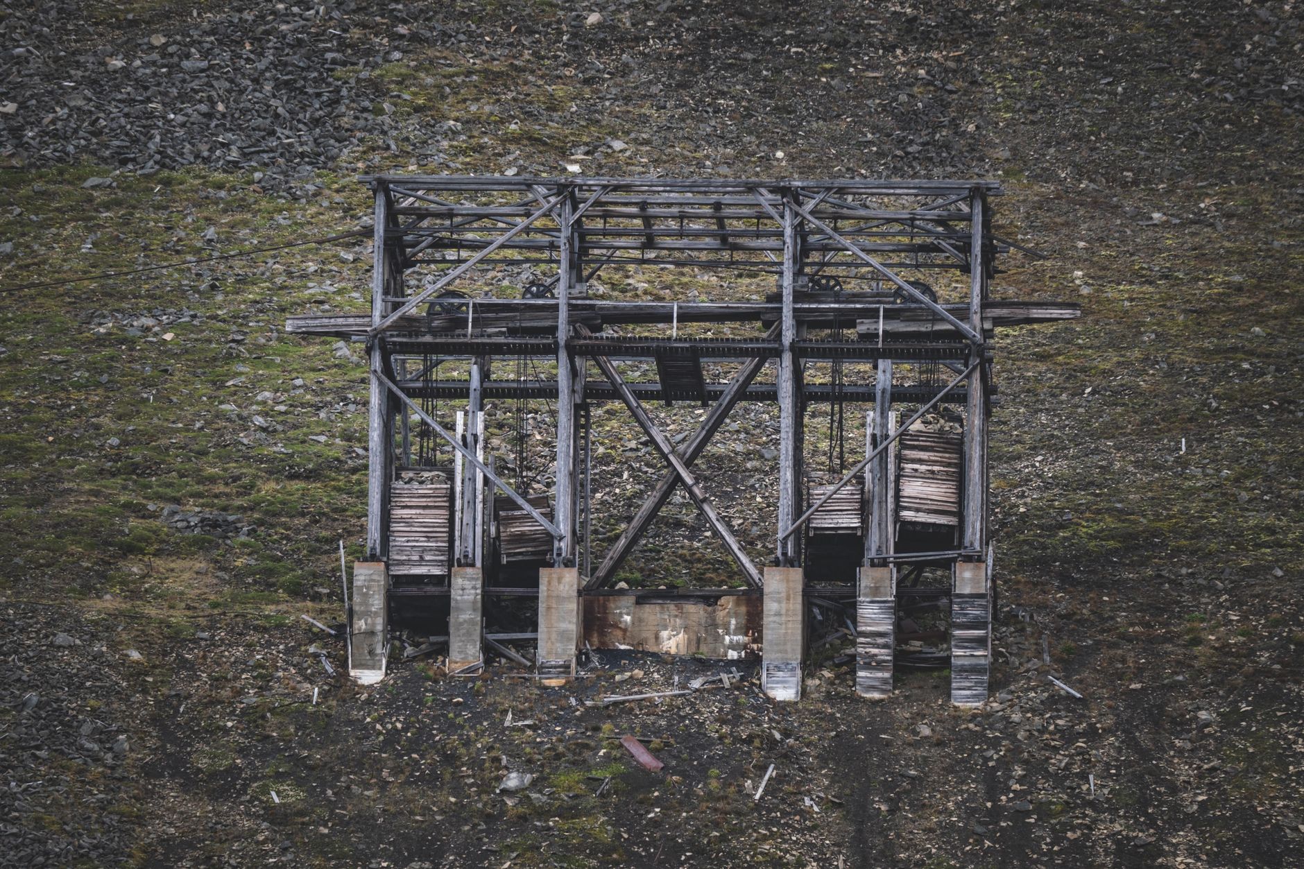 Aerial view of an open-pit graphite mining operation showing excavation layers