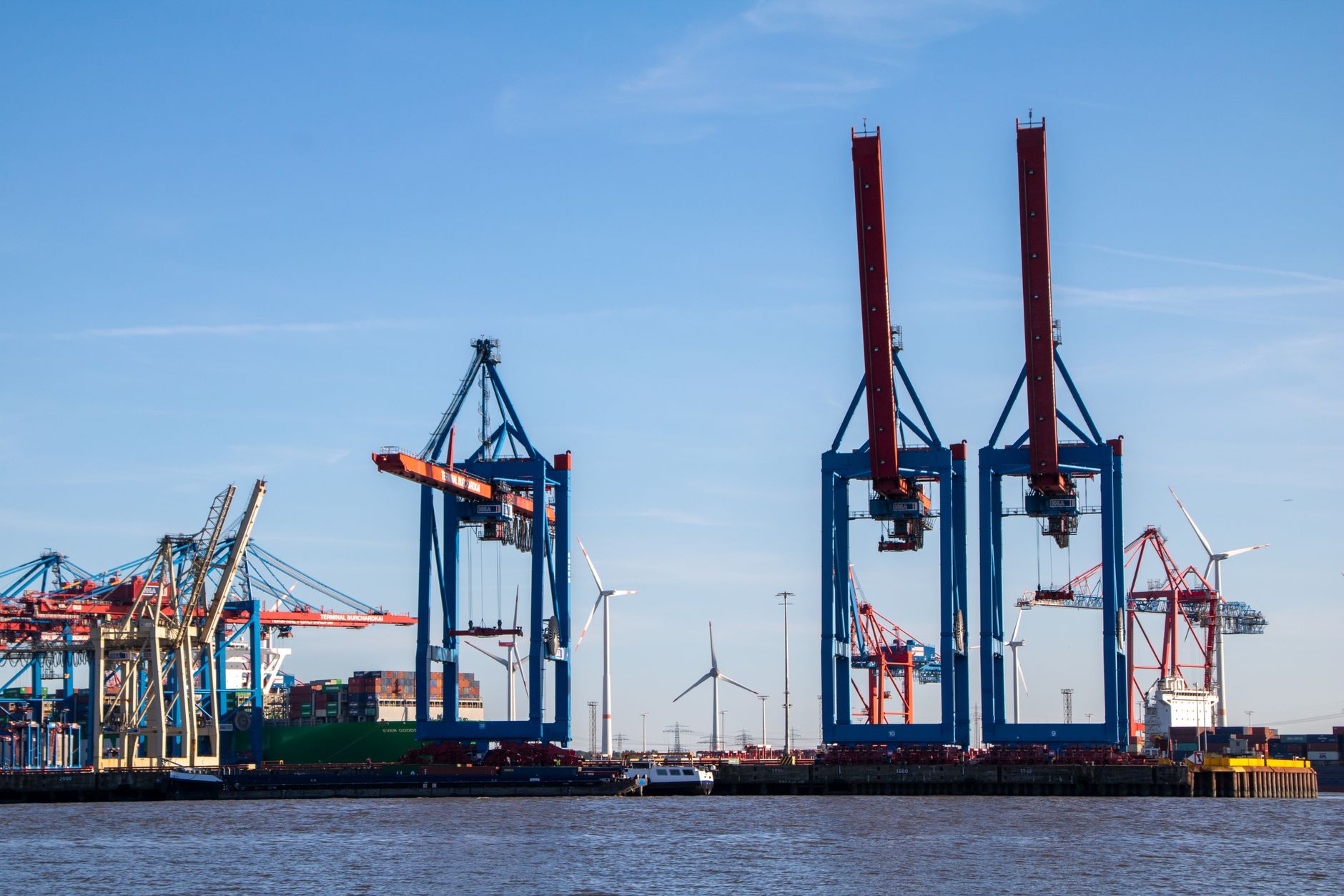 Large industrial chemical storage terminal at a port facility with tank infrastructure