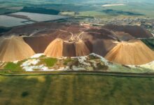 Aerial view of an active potash mine with extraction equipment and mineral deposits