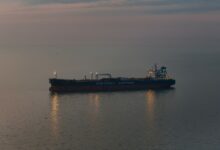 Large crude oil tanker vessel sailing across open ocean waters