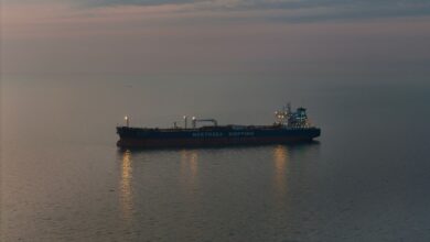 Large crude oil tanker vessel sailing across open ocean waters