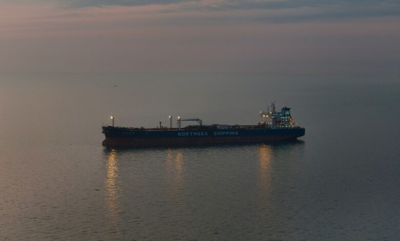 Large crude oil tanker vessel sailing across open ocean waters