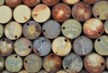 Large crude oil storage tanks at an industrial facility