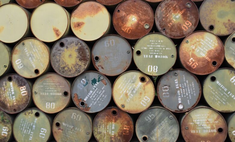 Large crude oil storage tanks at an industrial facility