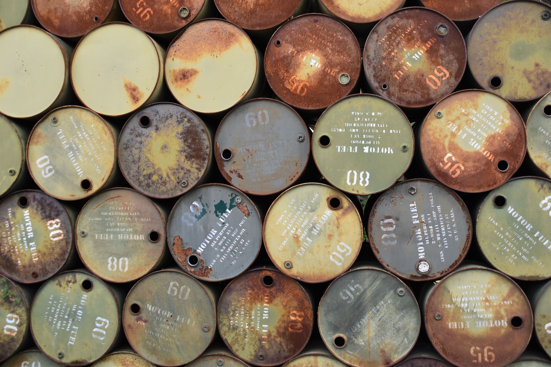 Large crude oil storage tanks at an industrial facility