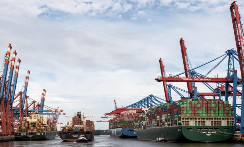 Large cargo vessel docked at an industrial port terminal