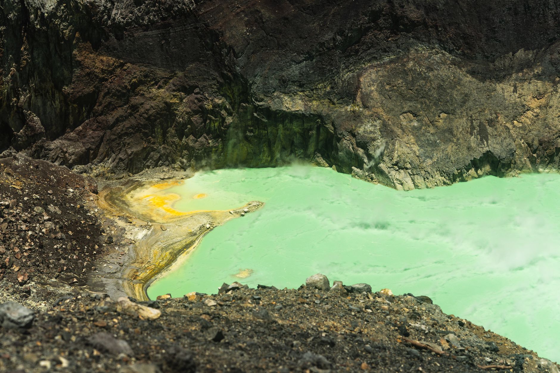 Bright yellow sulfur mineral deposits at an extraction site