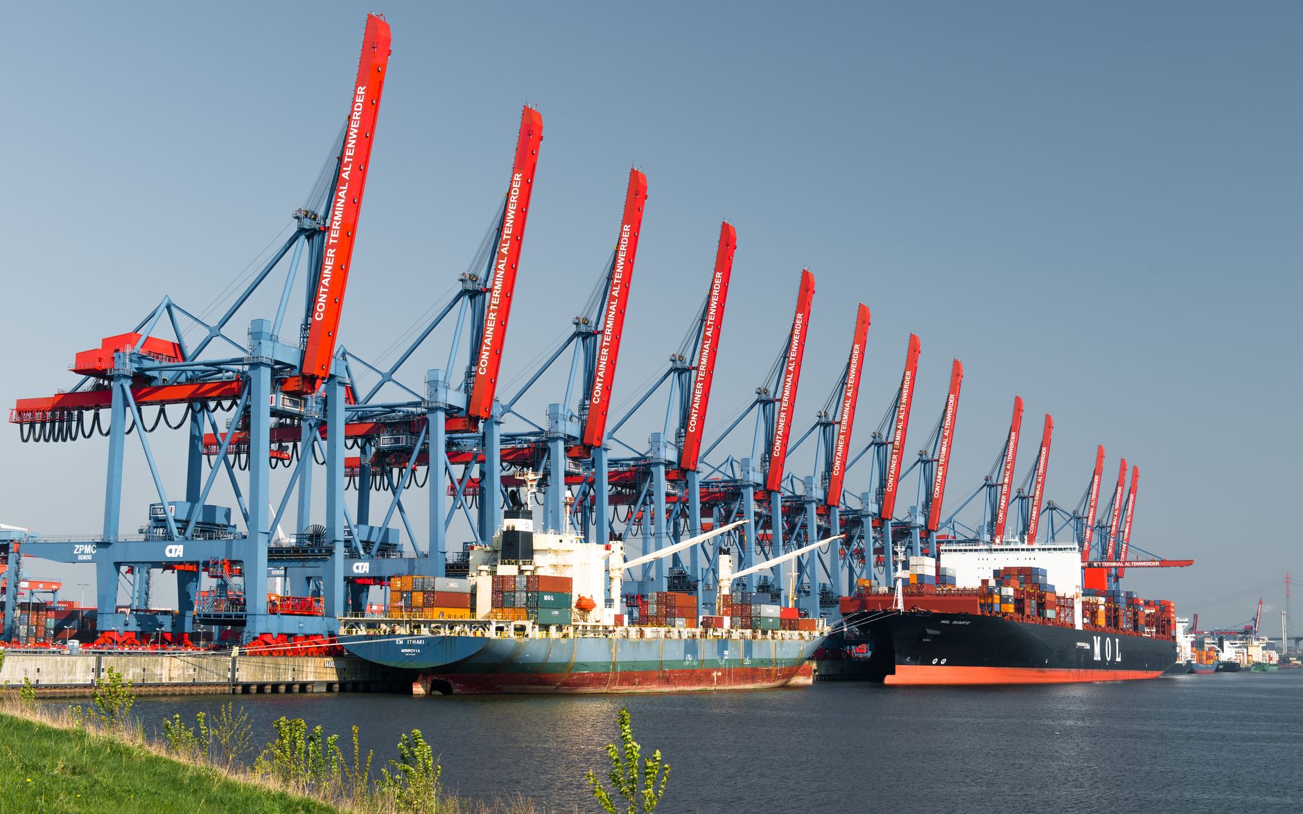 Aerial view of a commercial port with cargo facilities and berths