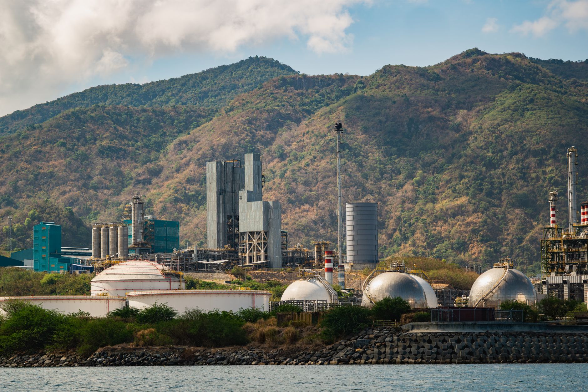Large industrial chemical processing facility with storage tanks