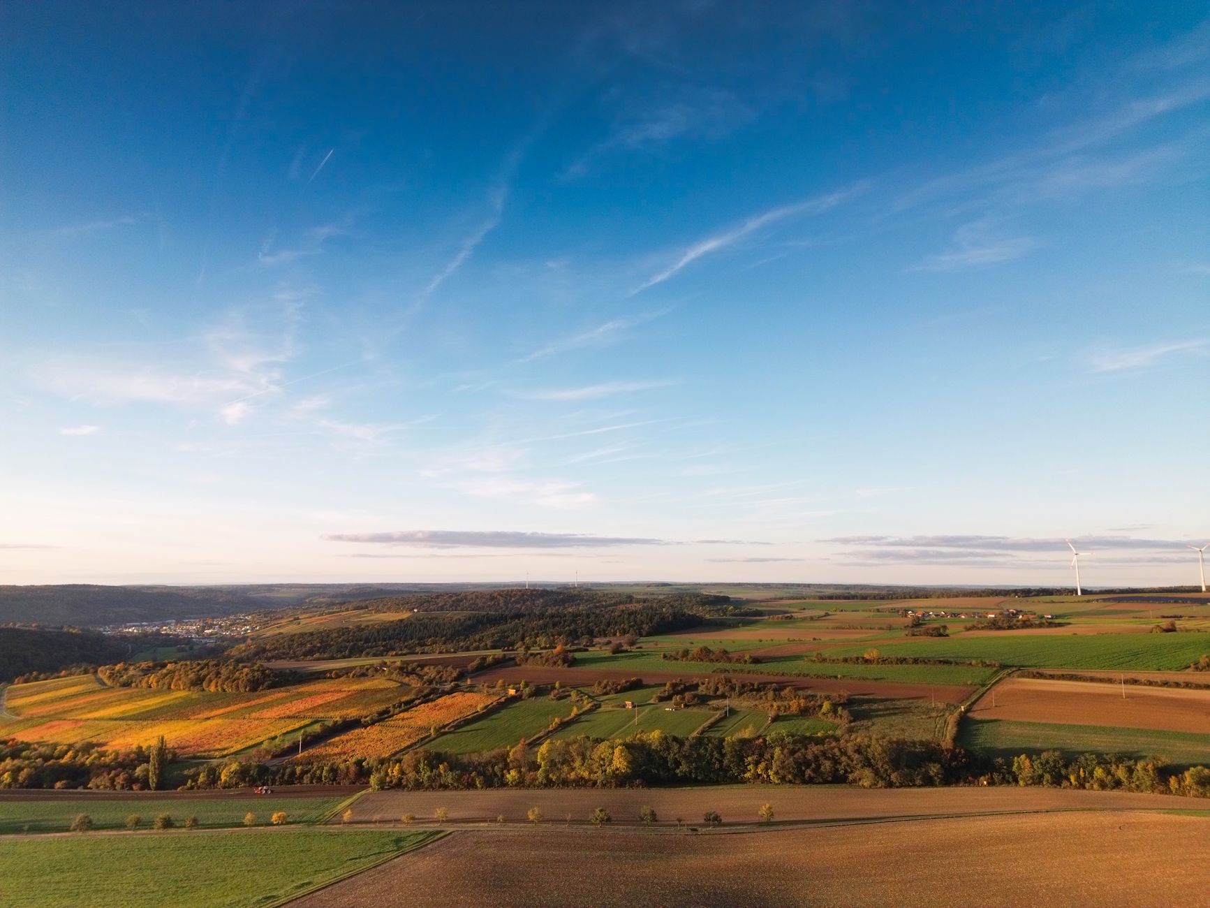 Aerial view of natural gas production field and surrounding acreage