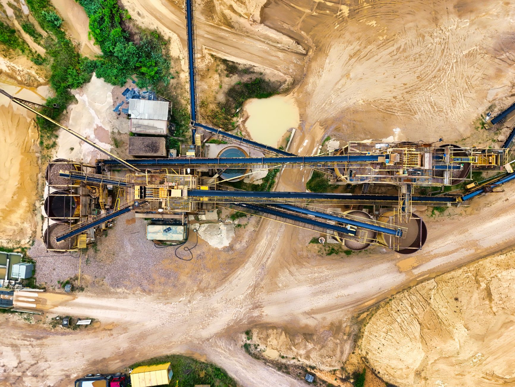 Industrial facility processing rare earth minerals with large chemical tanks